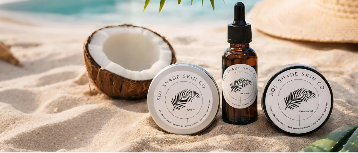 Skincare products from Boi Prince Skin Co on a sandy beach with a coconut and seashell.1621243260e1af0c20-0
